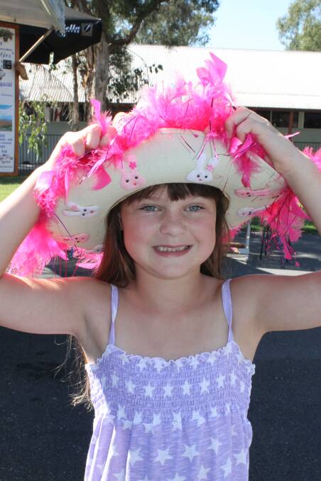 Jordyn Stancombe, 7, of Logan Village made a pretty pink hat for the Easter Bonnet Parade at the Logan Village markets on Saturday.