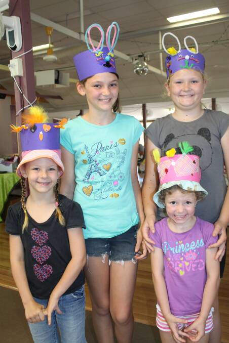 The Parker family of Stockleigh, Kayla, 6, Lauren, 11, Sammy, 4, and Hannah, 9, made Easter hats together to wear in the Easter Bonnet Parade at the Logan Village markets on Saturday morning. 