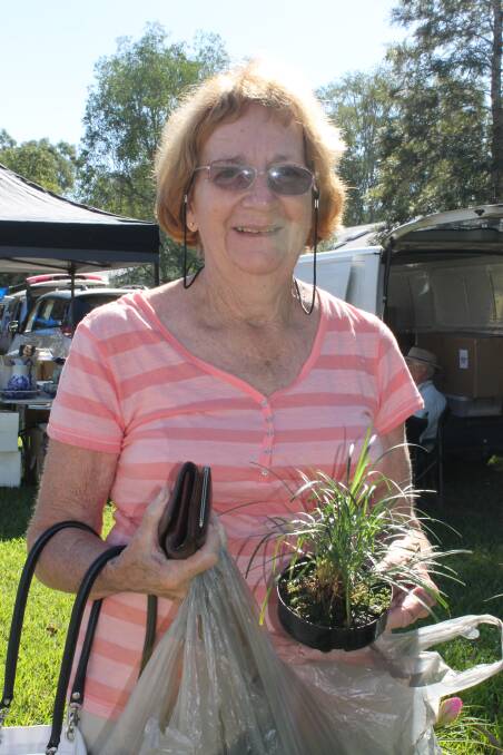 Eleanor Lyons of Jimboomba bought some mondo grass at the Logan Village markets on Saturday.