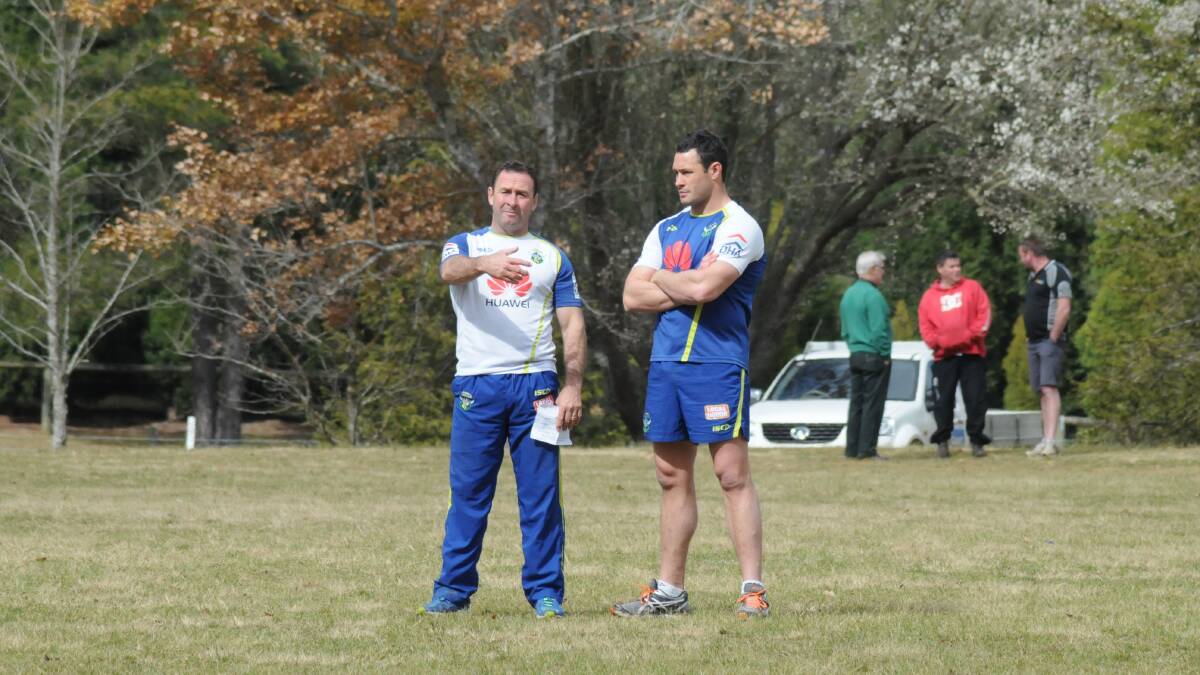 Canberra Raiders coach Ricky Stuart has a quick chat with Brett White during a training session at Chevalier College on Saturday morning. Photo by Lauren Strode
