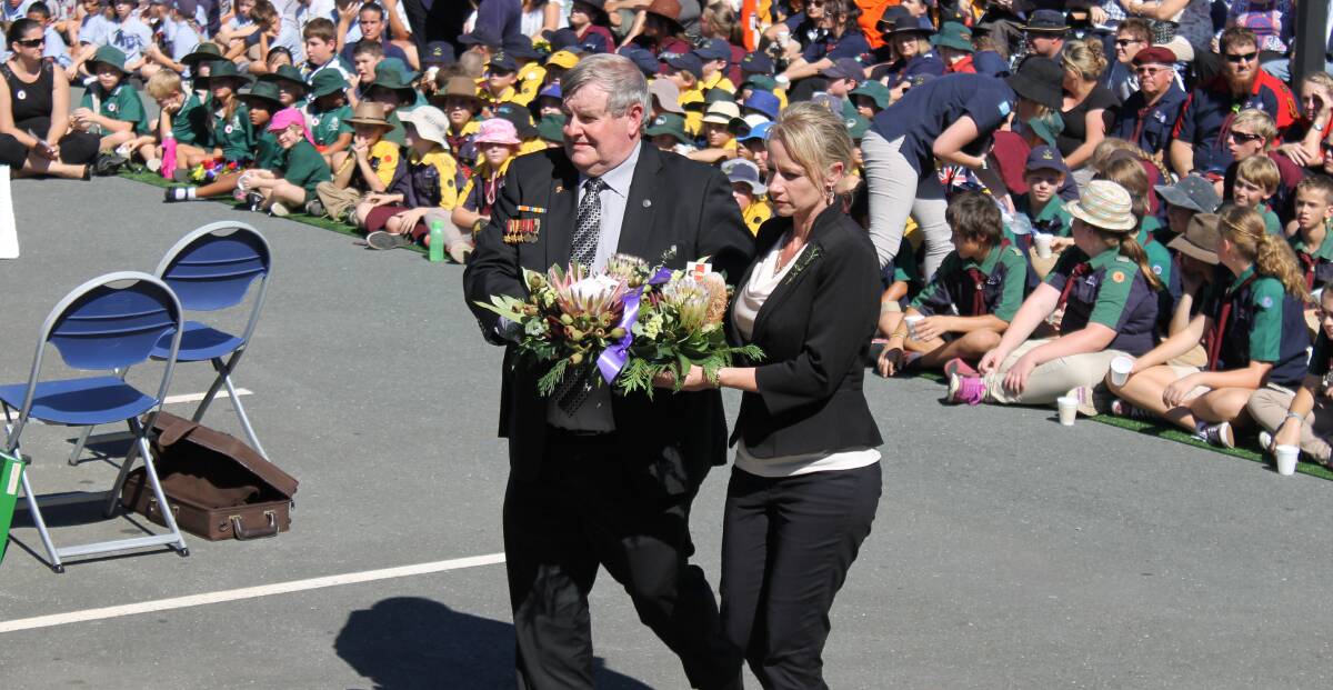 Logan City Councillors Laurie Smith and Trevina Schwarz lay a wreath at the Anzac Day service.