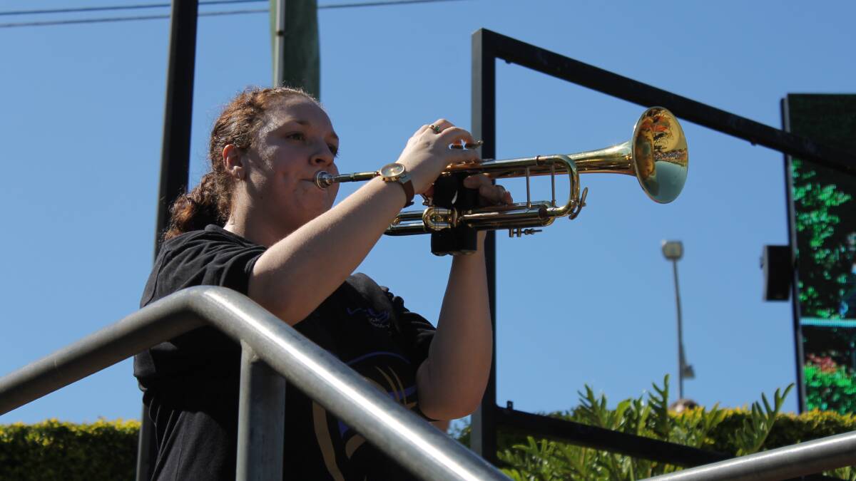 Sarah Fry, of the Logan City Brass Band, playing The Last Post at the Anzac Day service.
