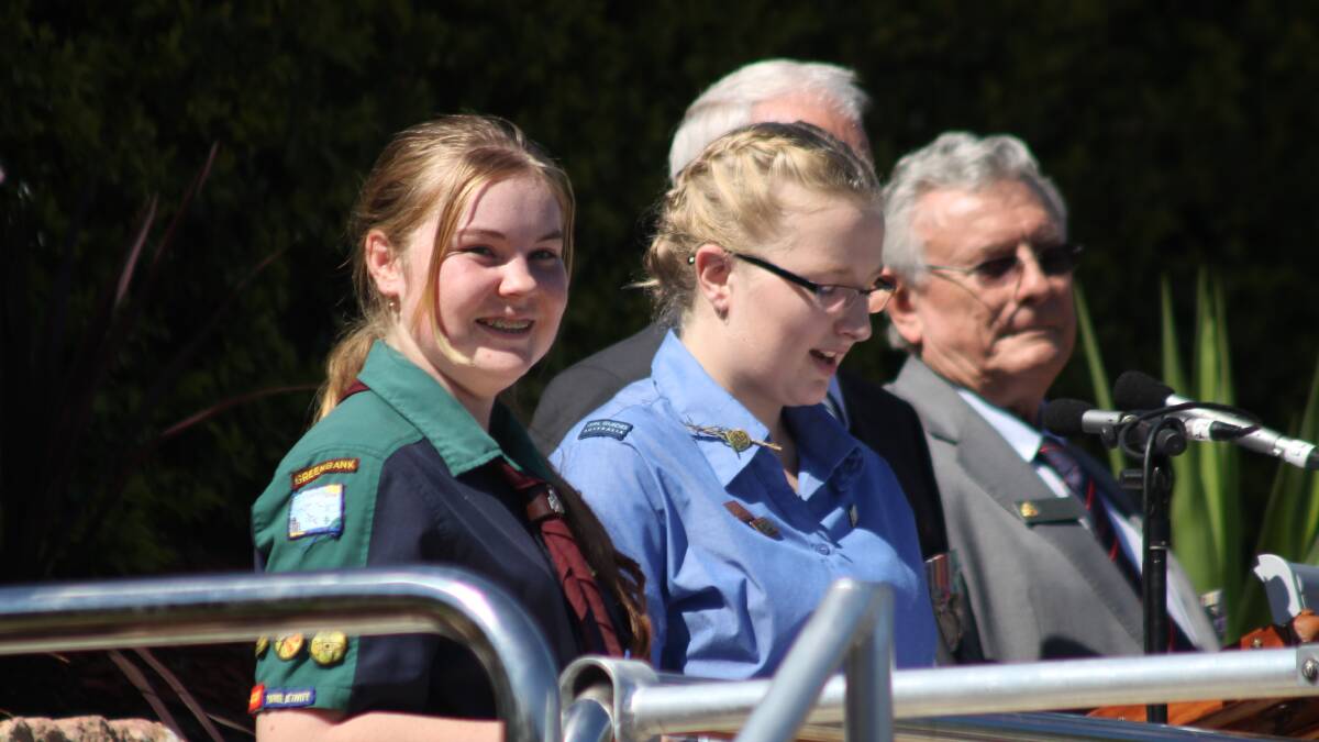 Greenbank Scouts member Paige Holgate and Browns Plains Girl Guide member Jade Frost speaking at the Anzac Day service.