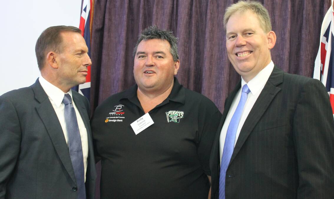Park Ridge Pirates AFL Club president Andy Colenso talks with Prime Minister Tony Abbott and Forde MP Bert van Manen at an afternoon tea at Loganholme on Wednesday.