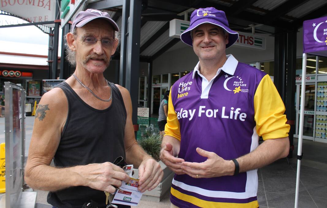 Jimboomba Relay for Life chairman Neil O’Brien spoke with Kooralbyn resident James Thom about Relay at an awareness day outside Woolworths in Jimboomba on Saturday.