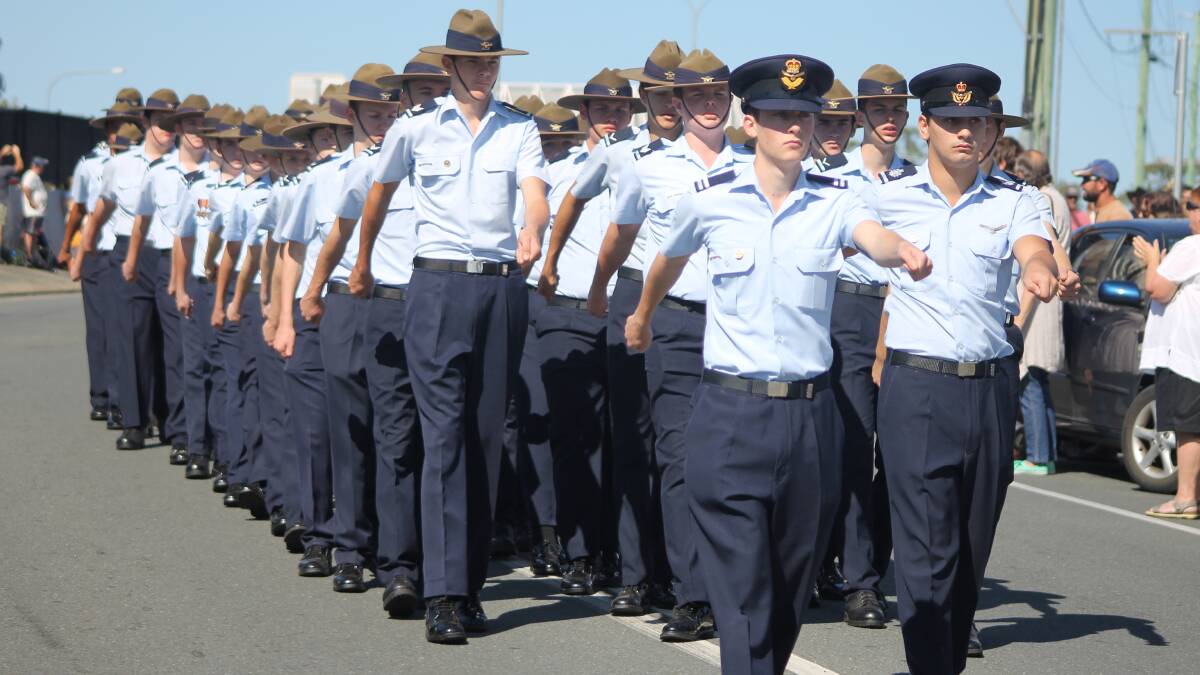 Cadet Under Officer Samuel Foenander and Warrant Under Officer Anthony De Luca lead the Australian Air Force Cadets 214 Park Ridge squadron in the march.
