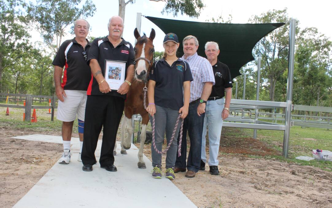 Tabol of Nolidge secretary Anthony Lunt and president Jeff Smith, Crowson Park Riding for the Disabled volunteer Kylie Barham with horse Tia, Logan Councillor Laurie Smith and Greenbank RSL Services Club president Eric Cavanagh enjoying the club's new concrete path and steel yards.