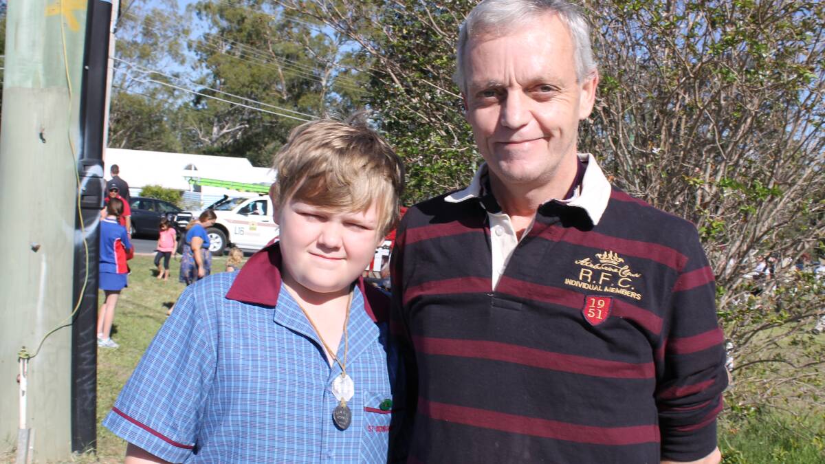 Bradley Carley and father Brian of Greenbank, marched in the Greenbank RSL sub-branch Anzac Day parade wearing his grandfather's dogtags.