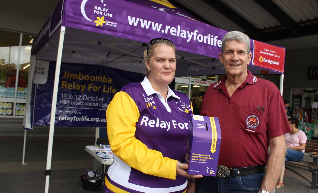 Jimboomba Relay for Life committee member Monica Farrow and Jimboomba VSASA treasurer Ray McCabbin help raise money for Relay at its awareness day on Saturday.