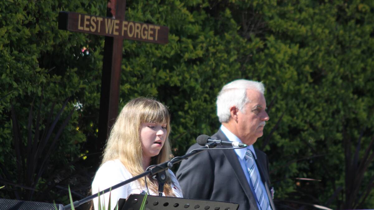 Amy Michaels singing at the Greenbank RSL sub-branch Anzac Day service.