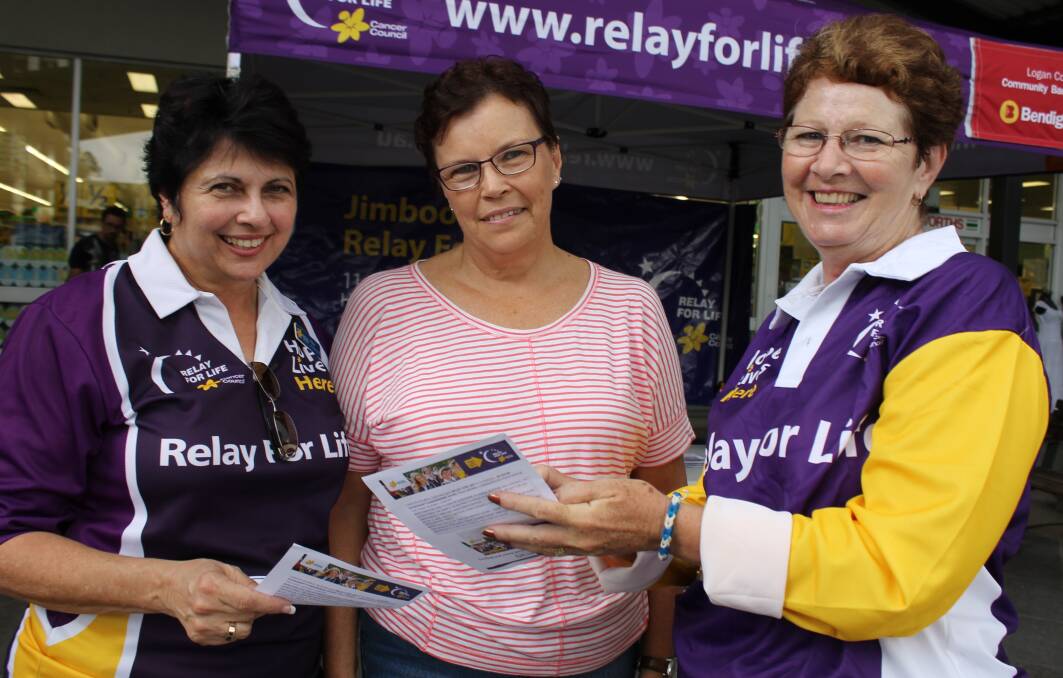 Ada Banks and Lee Tait talk to Jasmine Deveney (centre) about Relay at an awareness day outside Woolworths in Jimboomba on Saturday.