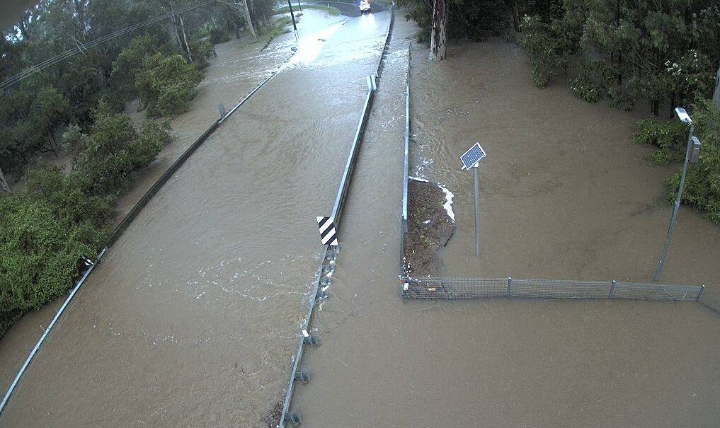 The Henderson Creek bridge at Cusack Lane in Jimboomba is under water. Photo: Logan Disaster Dashboard.