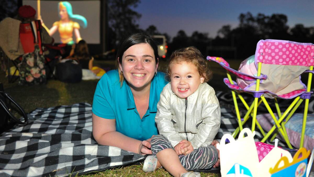 TROLL-WATCHING: Kayla Morrissey and her daughter Halaena, 2, of Flagstone, at the recent Flagstone Moonlight Cinema event. Photos: Supplied