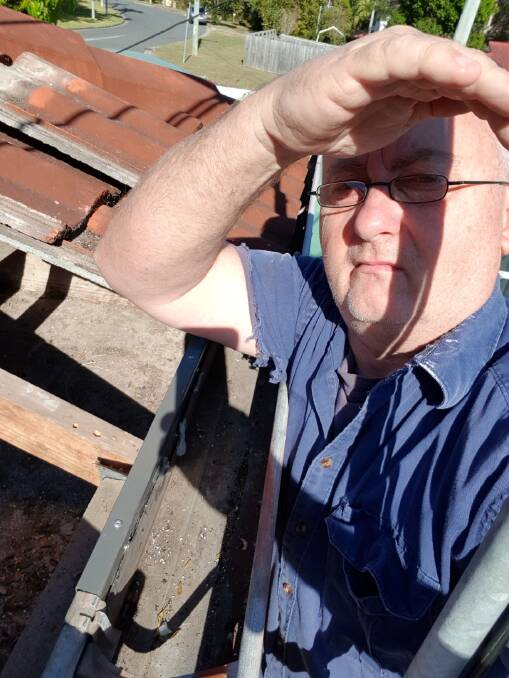 NOT HAPPY: Graham O’Keeffe, of Browns Plains, inspecting the damage to his property after contractors installed National Broadband Network infrastructure. Photo: Supplied