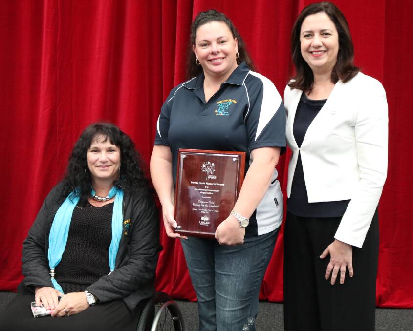 RIDING HIGH: Linda Gaffaney and Trish Hollis of Crowson Park Riding for the Disabled accepted the award for outstanding community organisation, with premier Annastacia Palaszczuk (right).