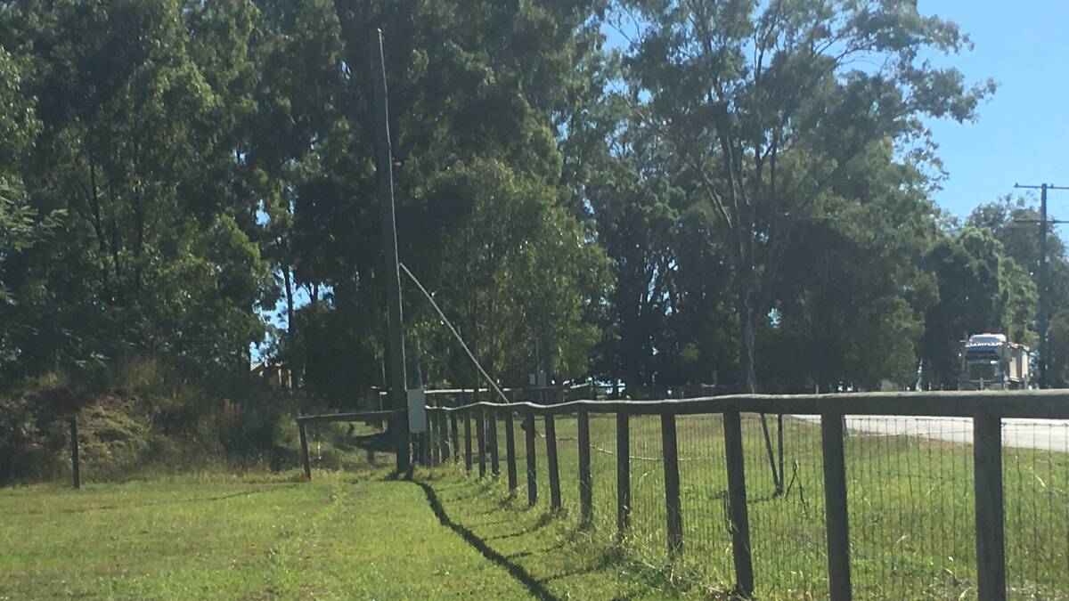 POLE FAIL: One of the affected power poles, with the conduit ripped from its fixtures. Photo: Supplied