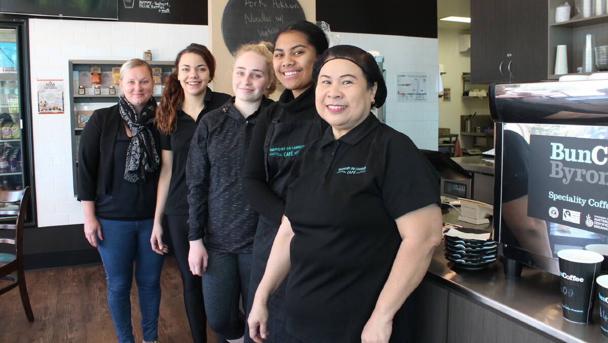 TEAM SPIRIT: Alicia Noble (left) and some of her team at Harmony on Carmody café in Logan Central. Photo: Michael Burge
