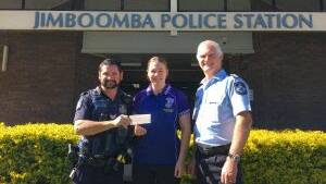 DONATION: Officers from the Jimboomba police station handed over the Blue Light donation to BMX champion Molly McGill. Photo: Supplied