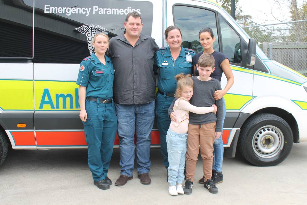 Troy Peace with advance care paramedics Bec Macdonald and Sue Neale and family Lisa Wallace, 9-year-old Max and 6-year-old Ava Wallace. Photo: Georgina Bayly 