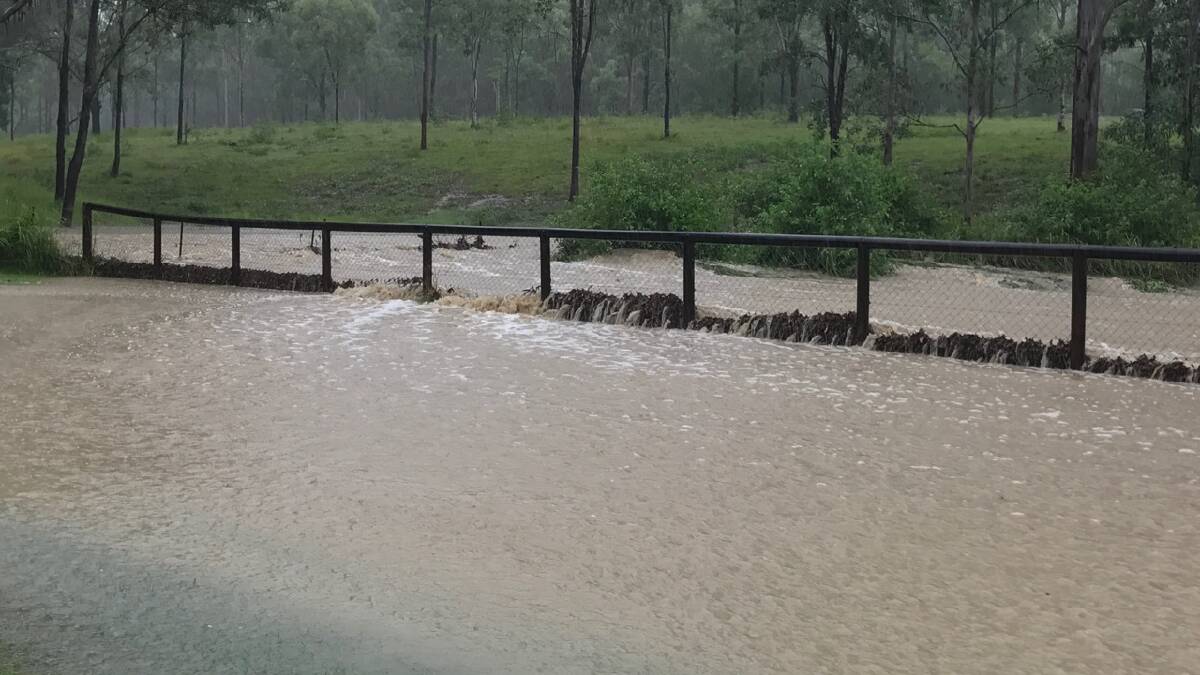 Myrtle Road, Jimboomba is being impacted by heavy rain falls. Photo: Shanna Watson.