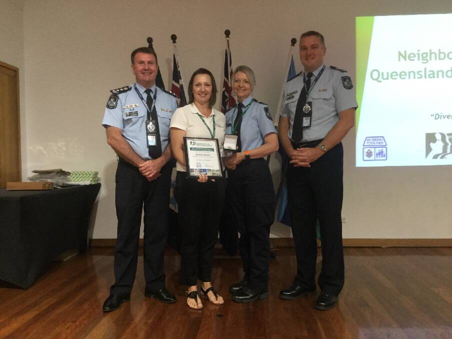 WINNER: Acting Chief Superintendent Ben Marcus, Mrs Jocelyn Marentis, from Forestdale Neighbourhood Watch, Senior Constable Leanne Cole and Senior Sergeant Michael Leafe. Photo: Supplied by QPS