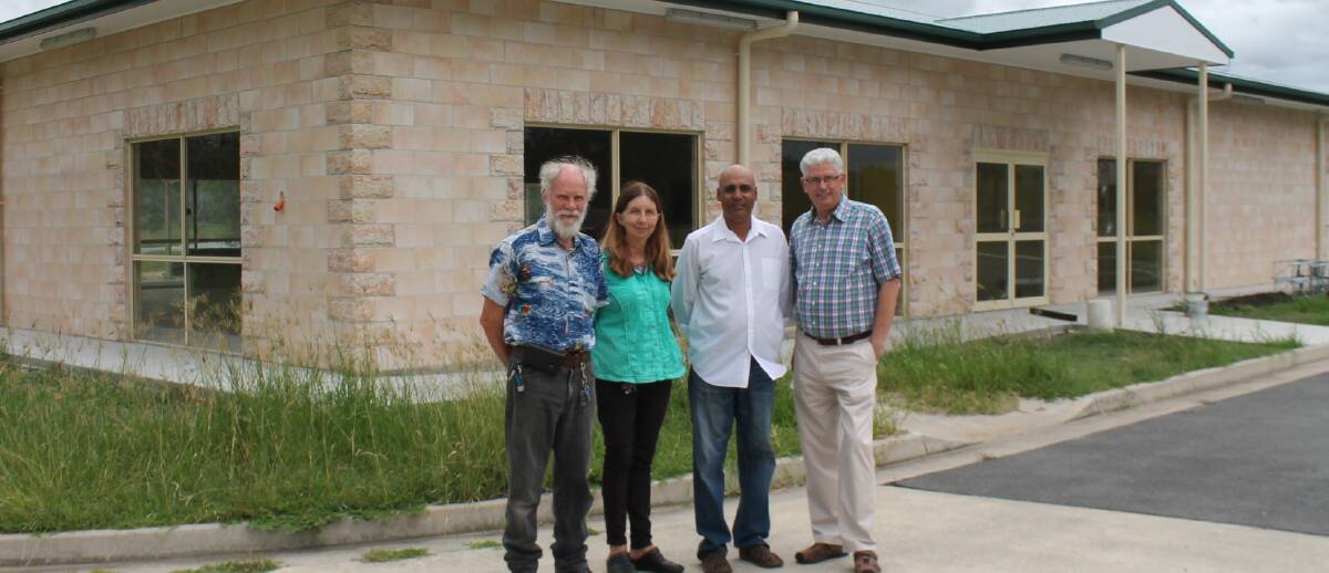 FUNDS: Mundoolun estate group representatives Bevan and Beth Hay and Raj Aggarwal with division four councillor Don Petersen.