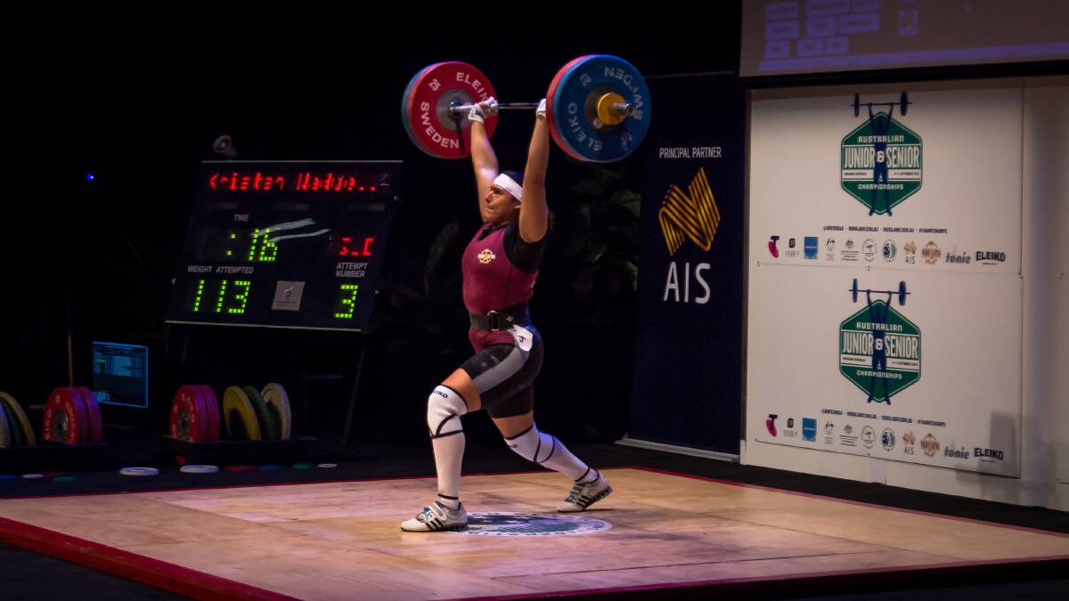 STRENGTH: Kristen Wadell during her 113kg clean and jerk lift at the Australian Weightlifting Championships. Photo: Field Media.