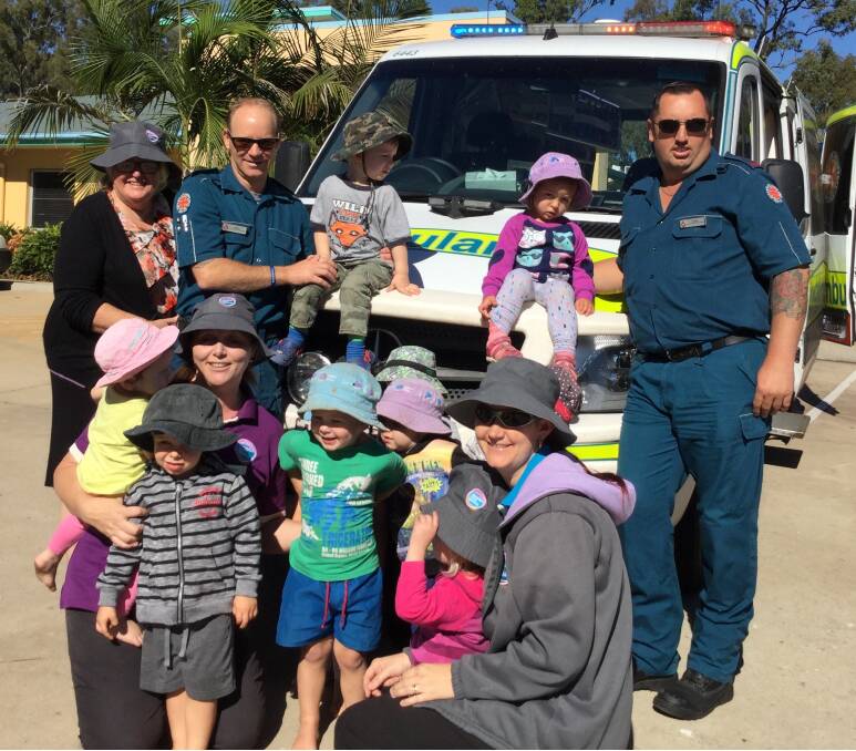 EMERGENCY SERVICES: Ambulance Officers Regn Skerry and Mark Parry with staff members Kaylene Hayter Melanie Smith, Amanda Bayada, children - Noah Bennett, Eliza Subrin, Jackson Janney and Ethan Green.