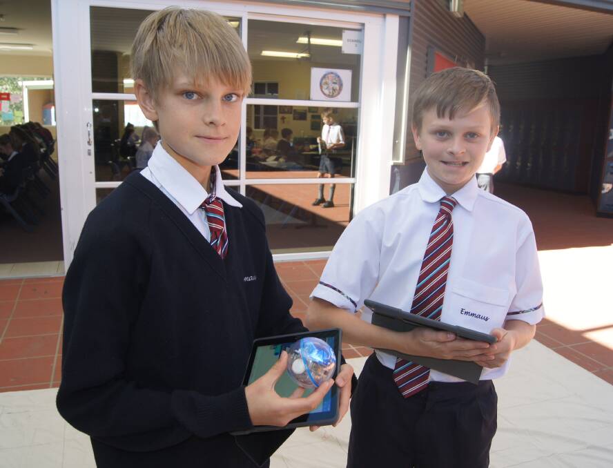 MATHS: Matt Robinson and Nick Coulter, both year 7, with Sphero and their iPads. Photo: Georgina Bayly