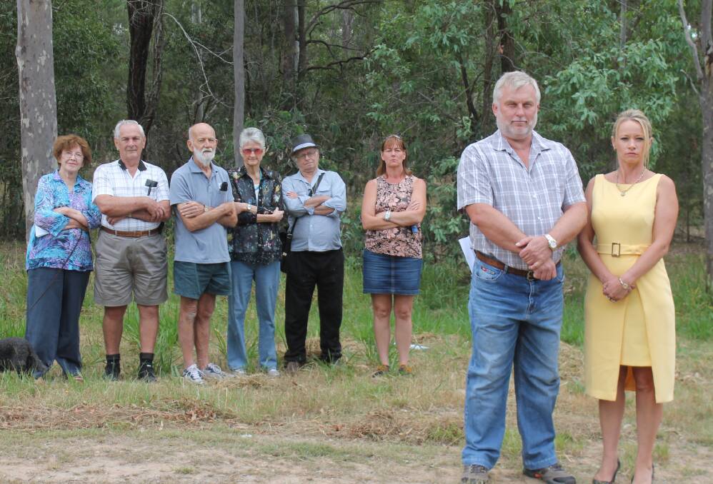 UNHAPPY: Chris Griffiths, Logan City councillor Trevina Schwarz and residents stand opposed to increased development in Greenbank. Photo: Georgina Bayly