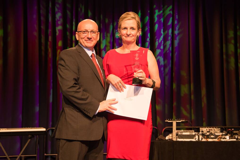 WINNER: Steven Alderman from Playgroup Queensland presenting the Excellence and Innovation in Pedagogy and Practice Award to Sue Taylor, Director of C&K Flagstone Community Kindergarten. Photo: SUPPLIED