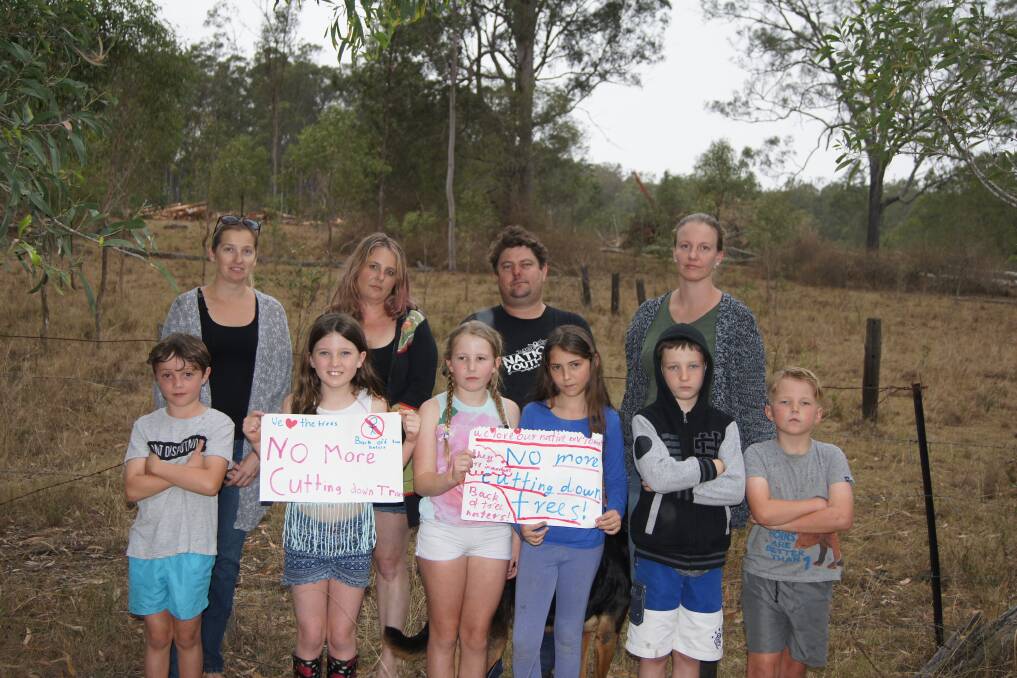 FED UP: Residents Hailey Mayes, Christine Johns, Jeremy Sheppard and Jocelynne Berry, pictured with their children and friends, are angered by the land clearing.