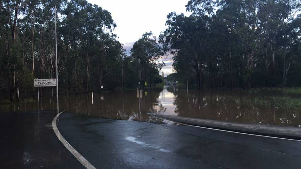Millstream Road was flooded again at 5pm. Police said the water would rise with the Logan River rise. Photo: Georgina Bayly