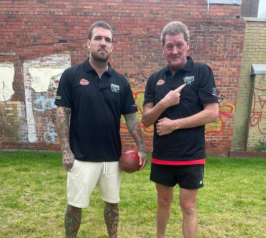 STOKED: Dane Swan and Ricky Nixon show off their Park Ridge Pirates polo shirts ahead of Saturday's game. Picture: Park Ridge Pirates Facebook.