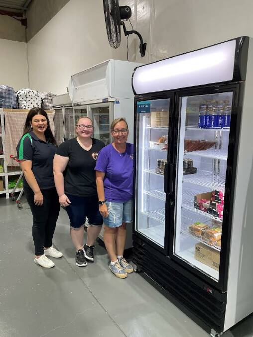 Madelaine Tiscia from AVJennings, Tomeeka Smith and Kathy Smith inspect the new fridge and freezer. Picture supplied