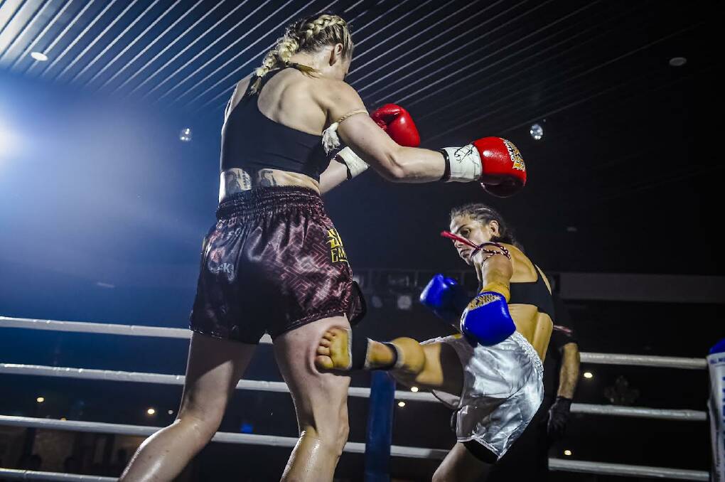 POWERFUL: Muay Thai champion Kim Townsend (right) won by a unanimous points decision. Picture: William Luu.