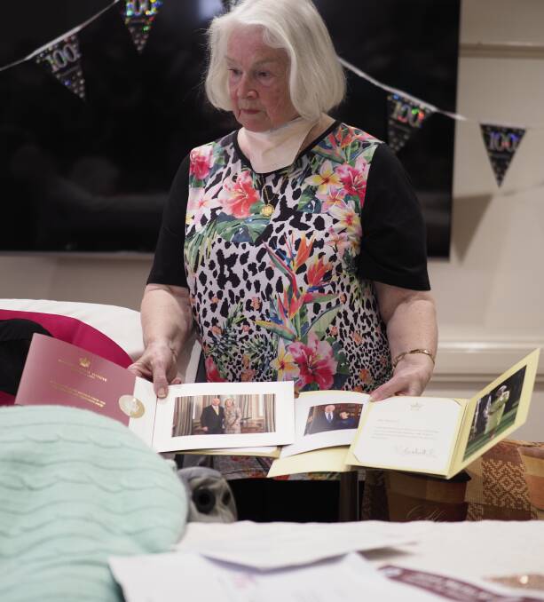 Annette Stevens shows some of the many letters her mother received on her 100th birthday. Picture by Joe Colbrook