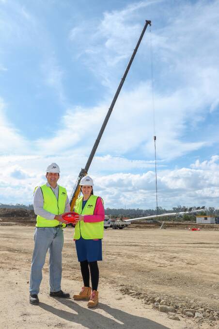 Mirvac Queensland Project Director Mark Clancy and Deputy Mayor Natalie Willcocks visited the construction site to celebrate the installation of new lighting poles. Picture supplied.