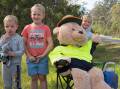 TEDDY BEAR'S PICNIC: Local youngsters Zane, Macauley and Jedd welcome the teddy bear to its new home on Camp Cable Road. Picture: Joe Colbrook.