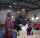 ELECTION DAY: Rankin MP Jim Chalmers (centre) and wife Laura cast their votes. Picture: Joe Colbrook.