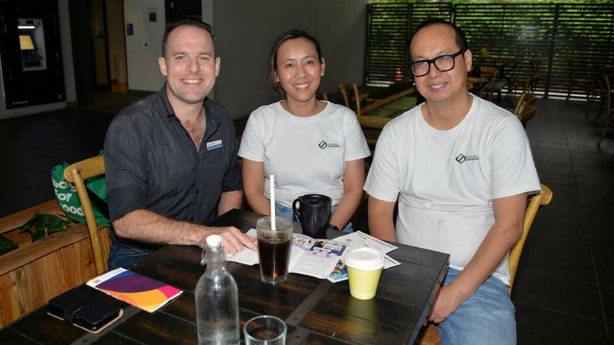 HERE TO HEAR: Councillor Jon Raven listens to feedback from Berrinba residents Linda and Phuc Nguyen, who operate Social Sphere Café at Marsden. Picture: Logan City Council.