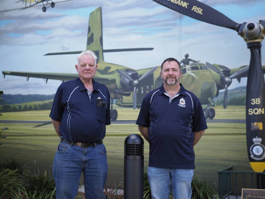 Greenbank RSL subbranch secretary Doug Watts and president Stewart Rae at the Greenbank Services Club's new RAAF mural. Picture by Joe Colbrook.
