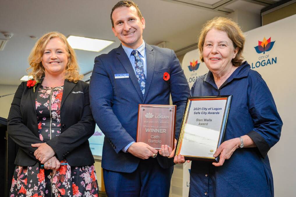 Councillors Laurie Koranski and Tony Hall congratulate Youth and Family Service (YFS) Chief Executive Officer Cath Bartolo at last year's City of Logan Safe City Awards. Picture supplied.