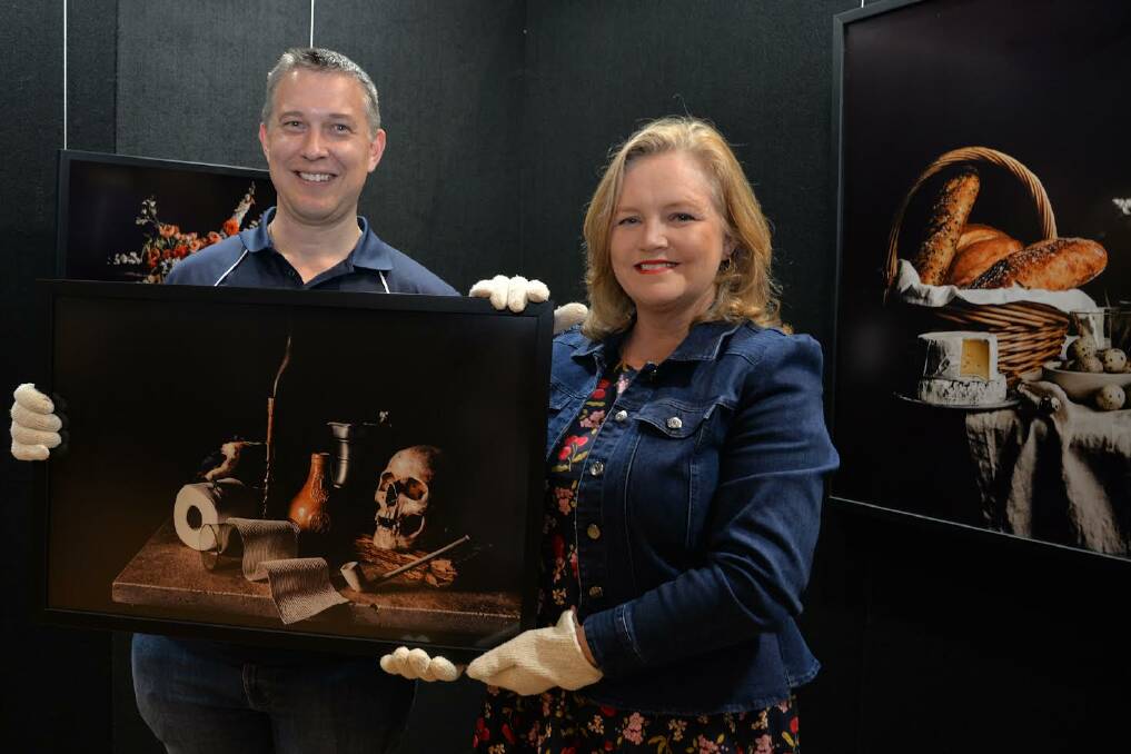 Division 7 Councillor Tim Frazer (left) and City Lifestyle Chair, Councillor Laurie Koranski with artworks by Rochedale South artist Christina Lowry which will be on display at the Logan Art Gallery Pop-Up. Picture supplied.