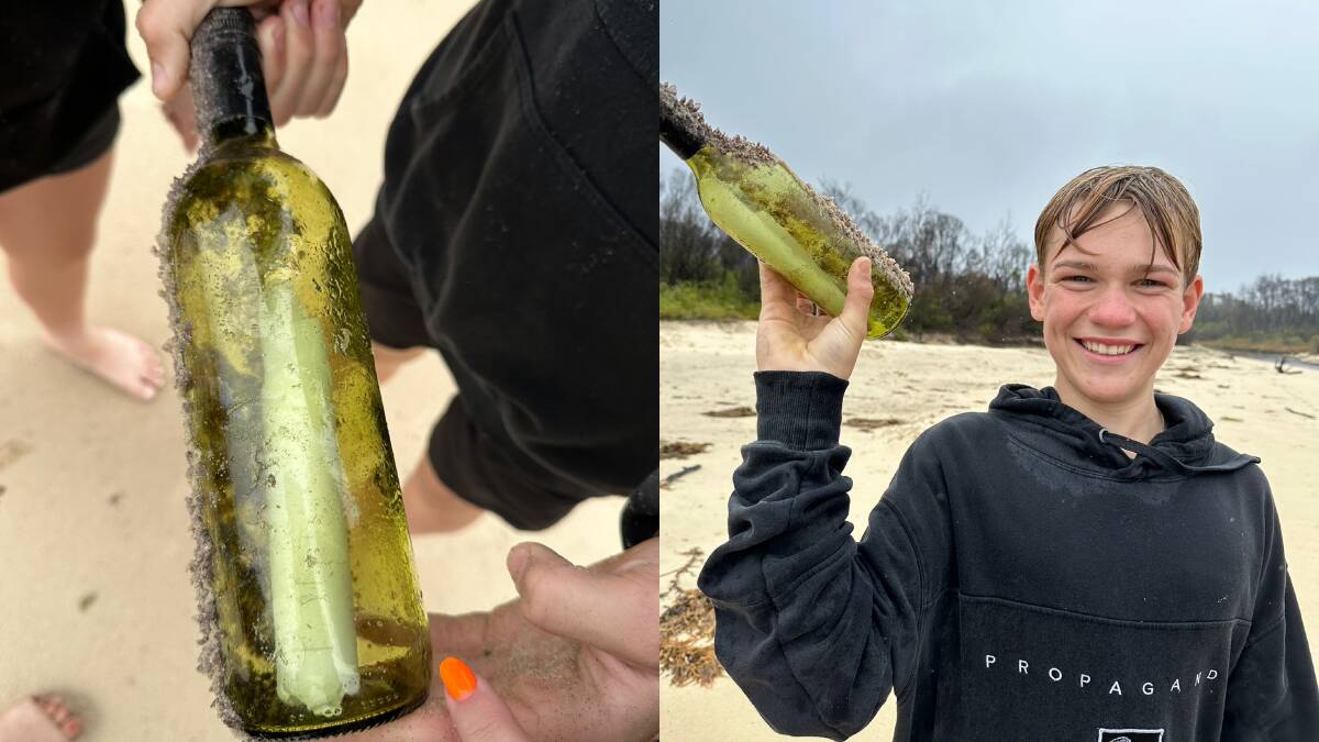 14-year-old Logan Russell with the message in a bottle he found. Picture supplied