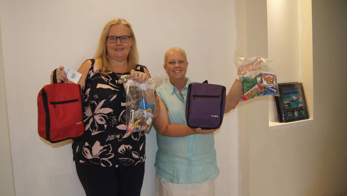 COMMUNITY SPIRIT: Jimboomba residents Helen McElroy and Michelle Galeazzi are collecting donations to support rural firefighters at south-east Queensland stations. Photo: Jacob Wilson 