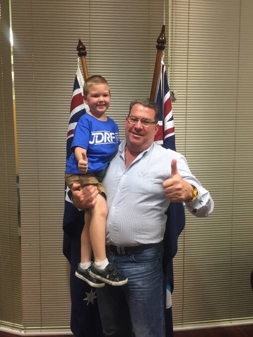 THUMBS UP: Five-year-old Yarrabilba boy Zephaniah with Wright MP Scott Buchholz discussing the importance of research into type one diabetes. Photo: Supplied