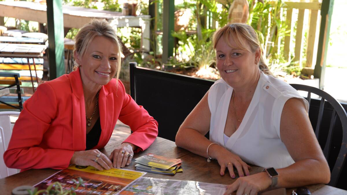 SUMMIT: Councillor Trevina Schwarz and Allyson Clarke look over the Jimboomba Summit program and map ahead of the event on Thursday, March 21. 