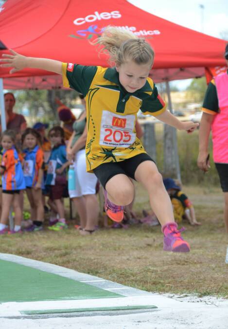IN MOTION: Amelia Lowe competed in the under six girls long jump at the annual Track and Field Carnival.