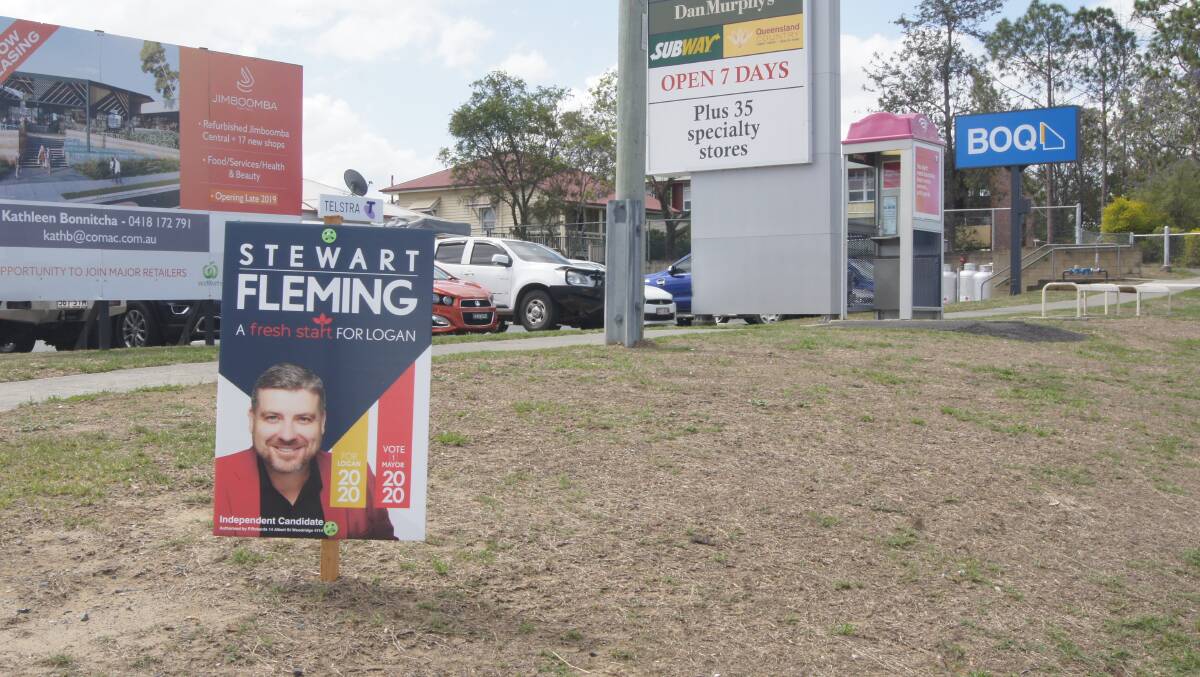 CAMPAIGN: Election signage has appeared near the Jimboomba Tavern as the 2020 Logan City Council race heats up. Photo: Jacob Wilson